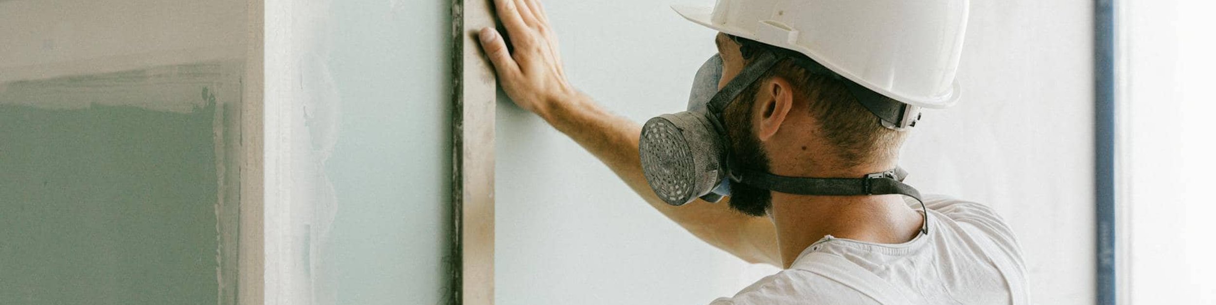 Man working on drywall